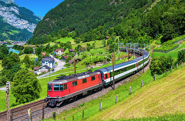 Intercity train climbs up the Gotthard railway. The traffic will be diverted to the Gotthard Base Tunnel in December 2016.