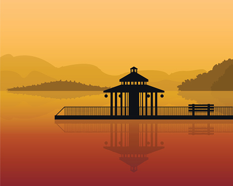 landscape - silhouette of a house on a background of mountains, sky with reflection in water.
