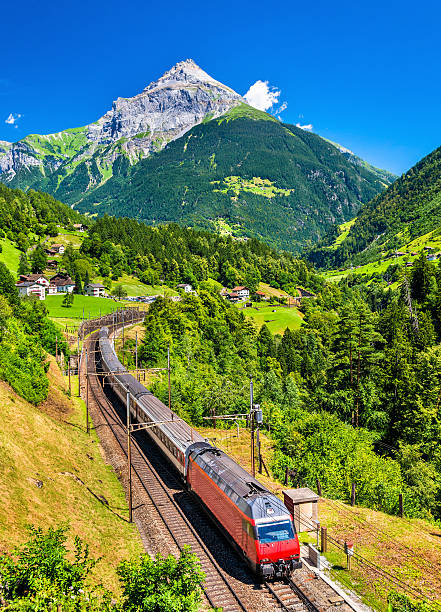 intercity train climbs up the gotthard railway - switzerland - swiss culture switzerland landscape mountain imagens e fotografias de stock