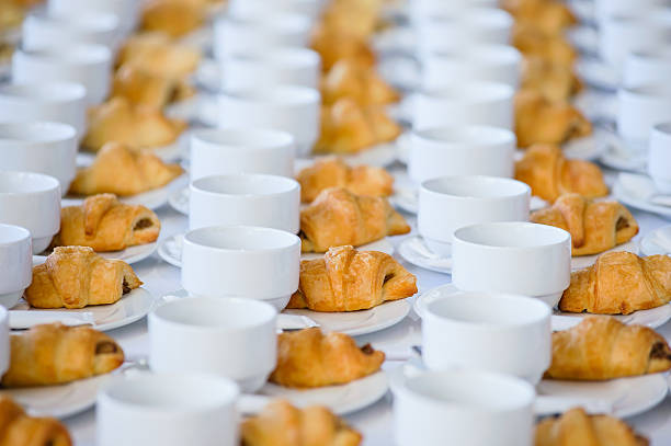 many croissant that place with empty cup are waiting for business people coffee break