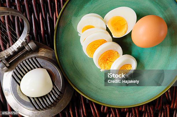 Hardboiled Egg Cut And Piled On Egg Slicer Stock Photo - Download