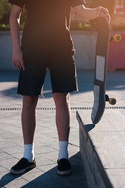 istock Person holding a skateboard. 615243296