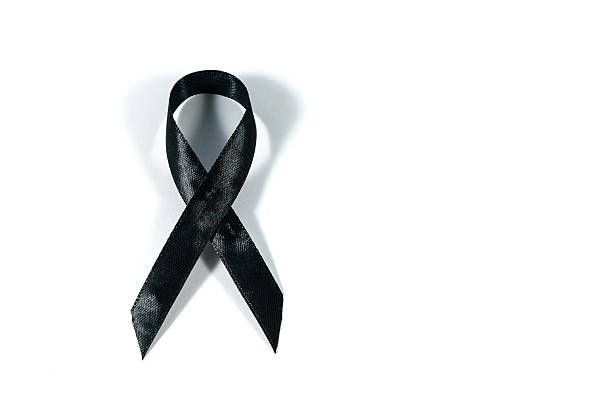 istock Black awareness ribbon isolated on white background. 615244712