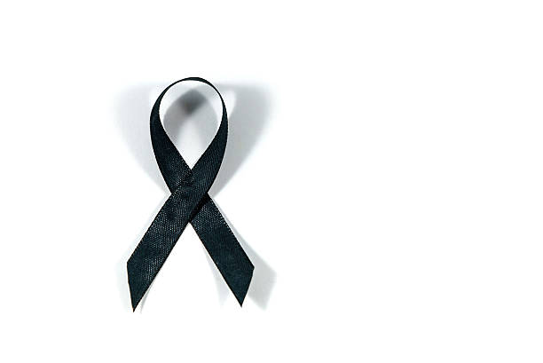 istock Black awareness ribbon isolated on white background. 615244766