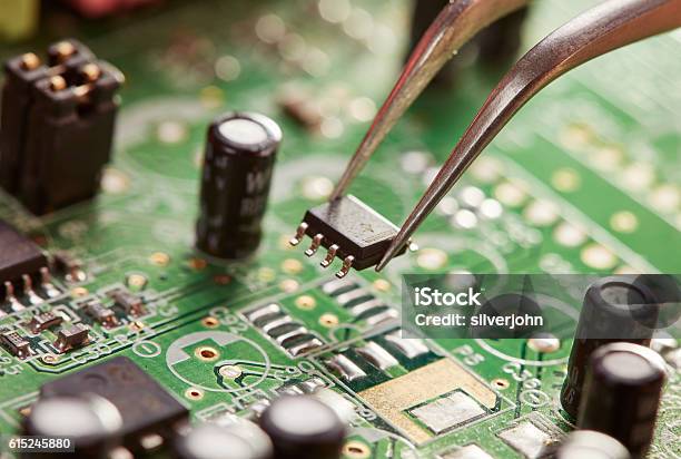 Tweezers With Chip Stock Photo - Download Image Now - Circuit Board, Electronics Industry, Production Line