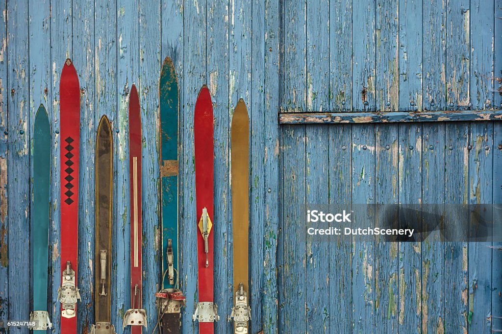 Collection of vintage wooden weathered ski's Collection of vintage wooden weathered ski's in front of an old barn Skiing Stock Photo