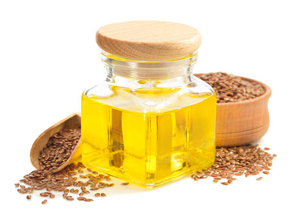 istock linseed oil in bottle isolated on white 615248702