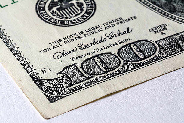 istock The old US $100 dollar bill macro. 615250440