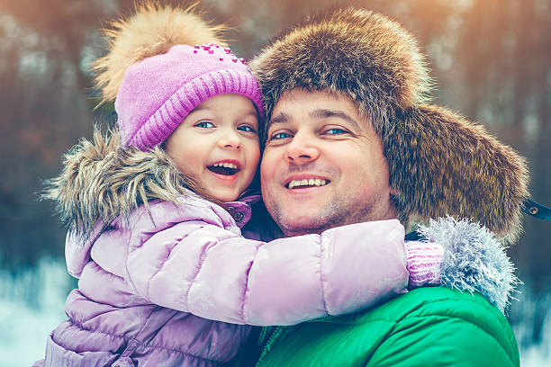 istock Father and daughter in winter 615252550