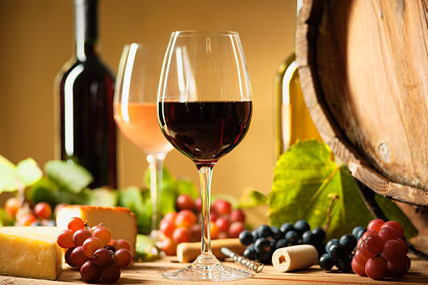 istock Wine bottle, glasses, cheese, grapes and barrel 615254030