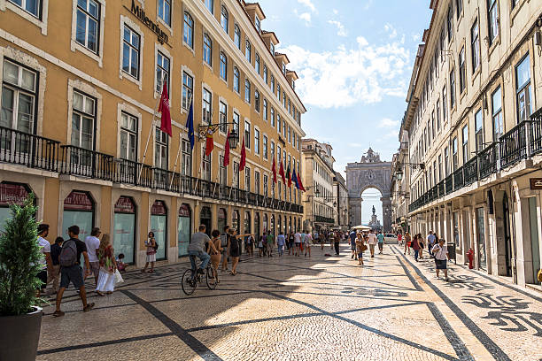Walking in central street with view on big arch