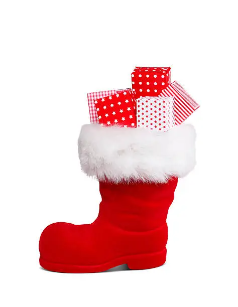 Red Santa's boot with gift boxes isolated with clipping path.