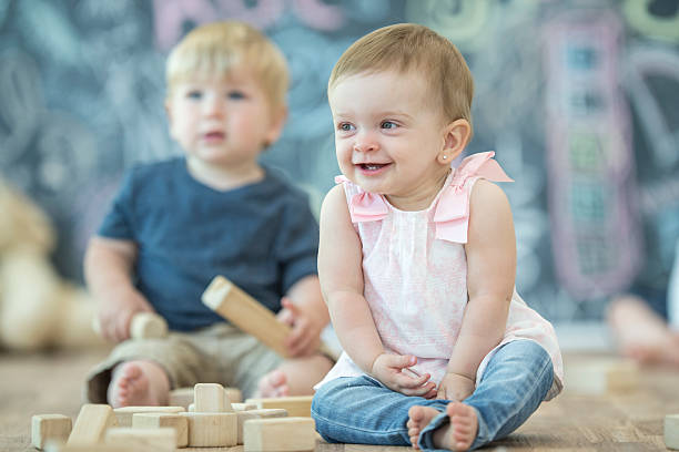 istock Toddlers Happily Playing Together 615262436