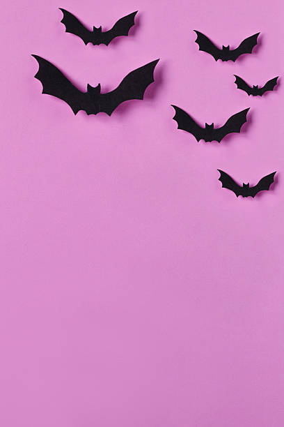 istock Halloween background. Papercut bats flying. Top view with copy space 615264020