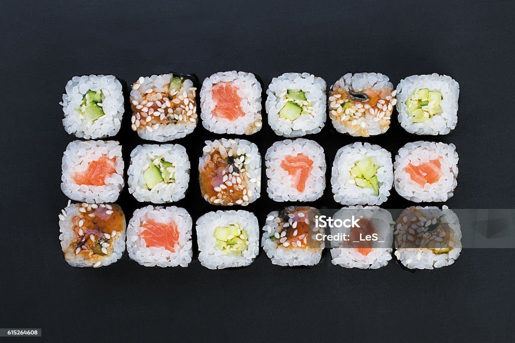 rolls Mix of Japanese nori rolls in on a black background Sushi Stock Photo