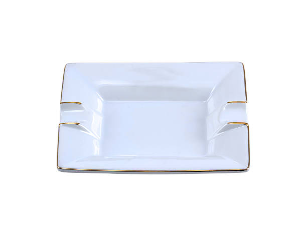 Empty white ceramic ashtray Closeup of a white ashtray isolated on white background nonsmoker stock pictures, royalty-free photos & images