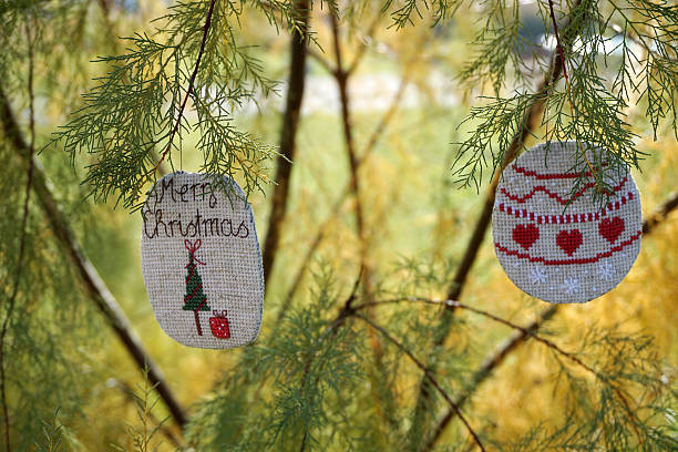 Christmas embroidery on the Christmas tree. Decorating, handmade. Cross-stitch.