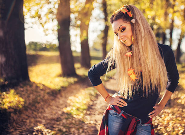 istock Girl in autumn 615266612