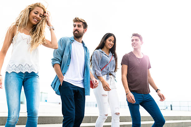istock Happiness multiracial Friends walking in Barceloneta 615266878