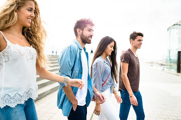 istock Happiness multiracial Friends walking in Barceloneta 615267036