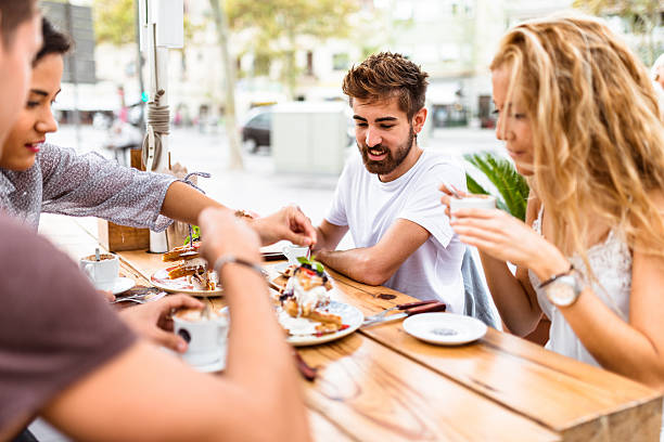 istock friends doing breakfast at the cafe 615268030