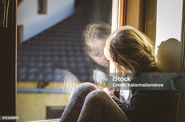 Child At The Window Stock Photo - Download Image Now - Blond Hair, Child, Childhood