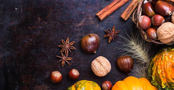istock Autumn fall halloween still life composition with pumpkin nuts chestnut 615269114
