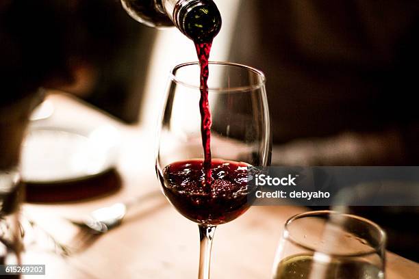 Wine Pouring Into Glass Stock Photo - Download Image Now - Wine, Red Wine, Wineglass