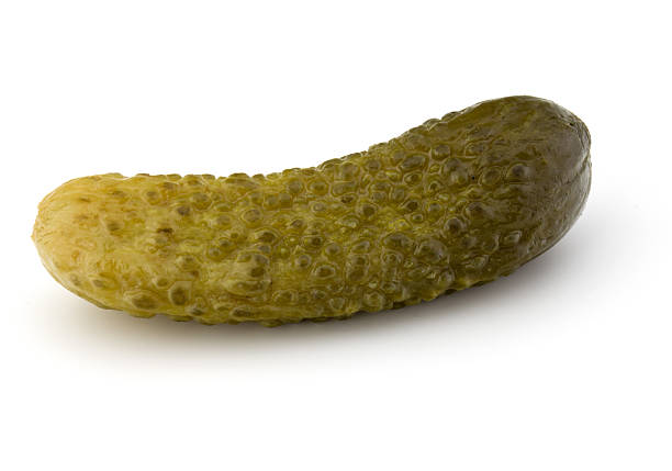istock pickled or marinated  cucumber isolated on white background 615269696