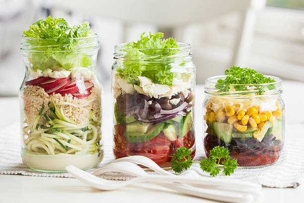 istock healthy vegetable cheese salad in mason jars 615273326