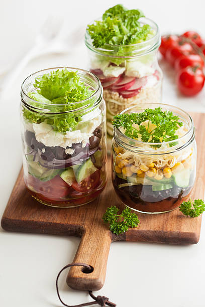 istock healthy vegetable cheese salad in mason jars 615273460