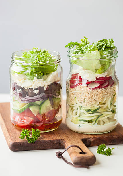 istock healthy vegetable cheese salad in mason jars 615273666