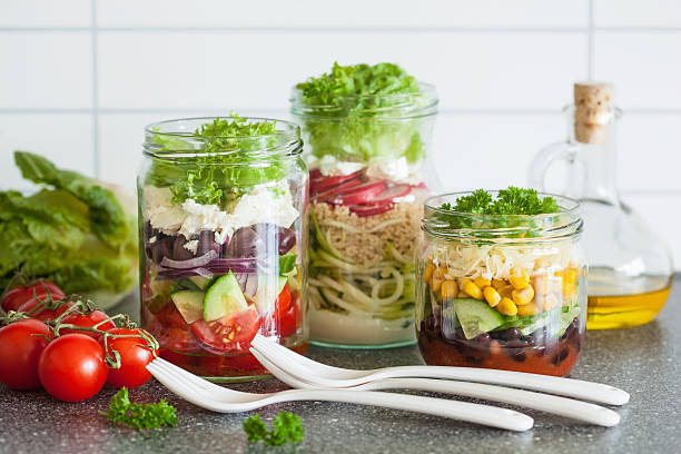 istock healthy vegetable cheese salad in mason jars 615273918