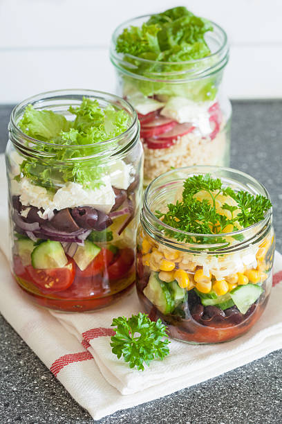 istock healthy vegetable cheese salad in mason jars 615274038