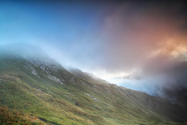 istock mountains covered with sunrise fog 615274796