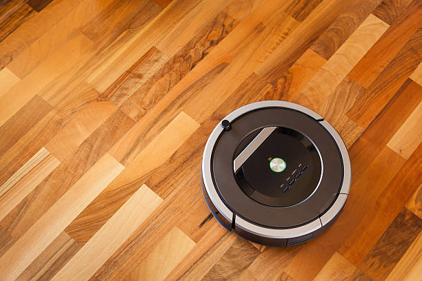 istock robotic vacuum cleaner on laminate wood floor smart cleaning tec 615276552