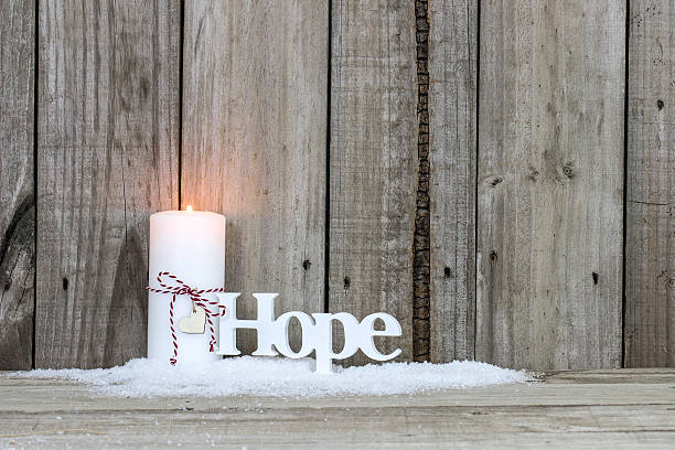 Christmas candle and the word Hope