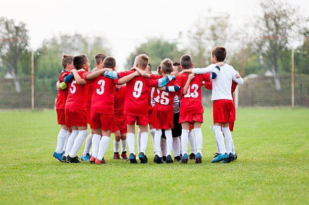 istock Little soccer players celebrating victory 615276906