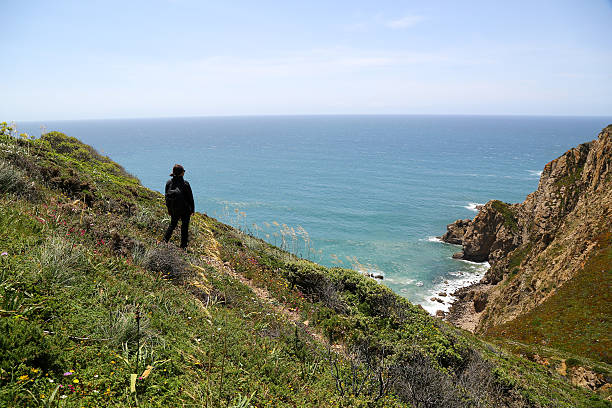 istock Woman top of a cliff 615279606