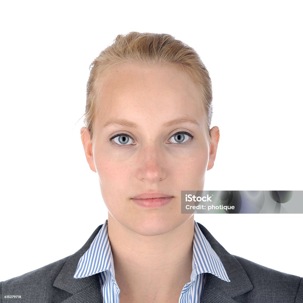 Businesswoman, portrait on white. Portrait of a young business woman shot to the aquirements of a usa passport photo. Photo Booth Picture Stock Photo