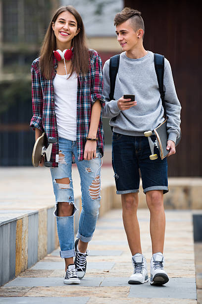 istock Teenagers with skateboards outdoors 615281144