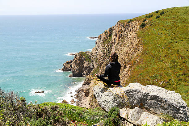 istock Woman top of a Cliff doing Yoga 615281146