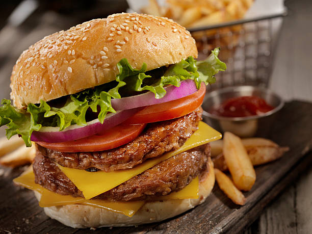 istock Double Cheeseburger with a Basket of Fries 615281300