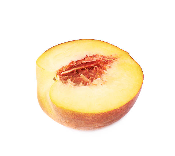 istock Half of a peach fruit isolated 615283638