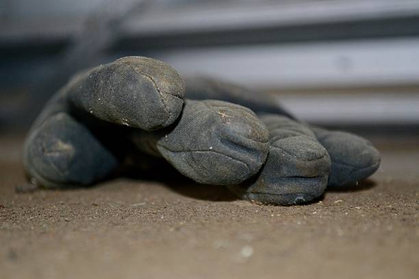 istock Dirty abandoned industrial construction glove 615286516