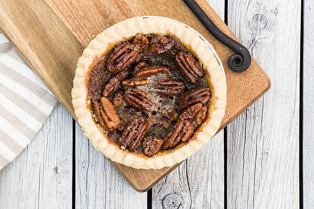 istock Whole pecan pie on the cutting board. 615286828