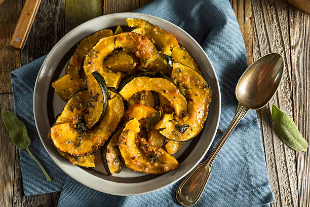 Homemade Autumn Baked Acorn Squash Homemade Autumn Baked Acorn Squash with Brown Sugar Glaze acorn squash stock pictures, royalty-free photos & images