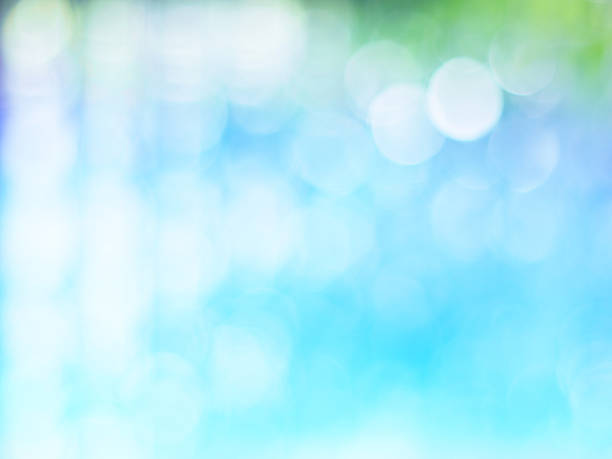 istock Abstract green and blue background with bokeh 615288216