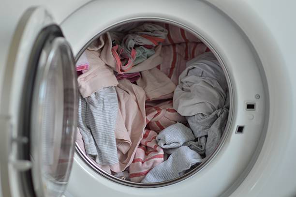 istock Close-Up Of Clothes In Washing Machine 615312305