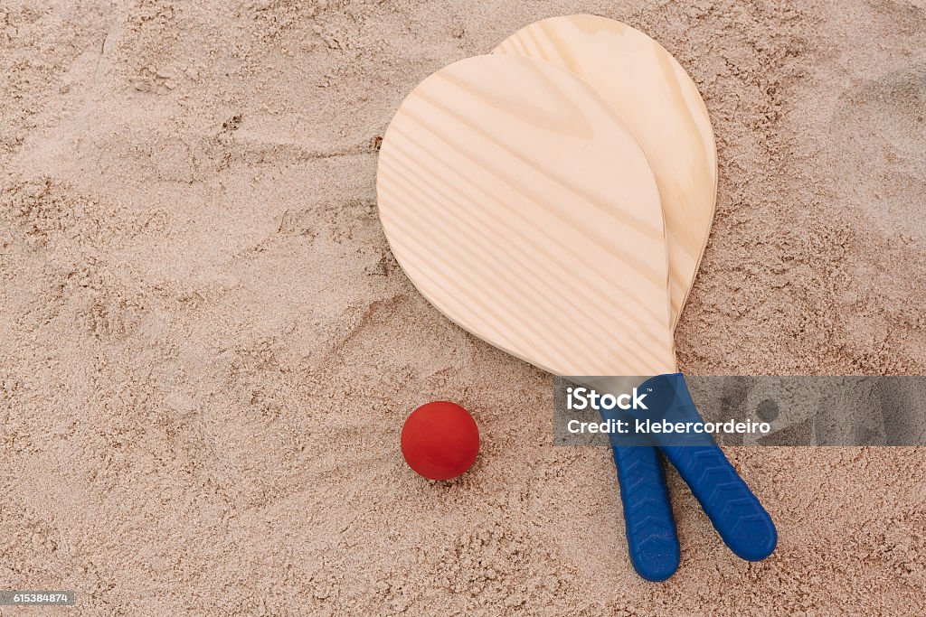Beach tennis, beach paddle ball, matkot. Beach rackets and ball Beach tennis, beach paddle ball, matkot. Beach rackets and ball on the beach sand Racket Stock Photo